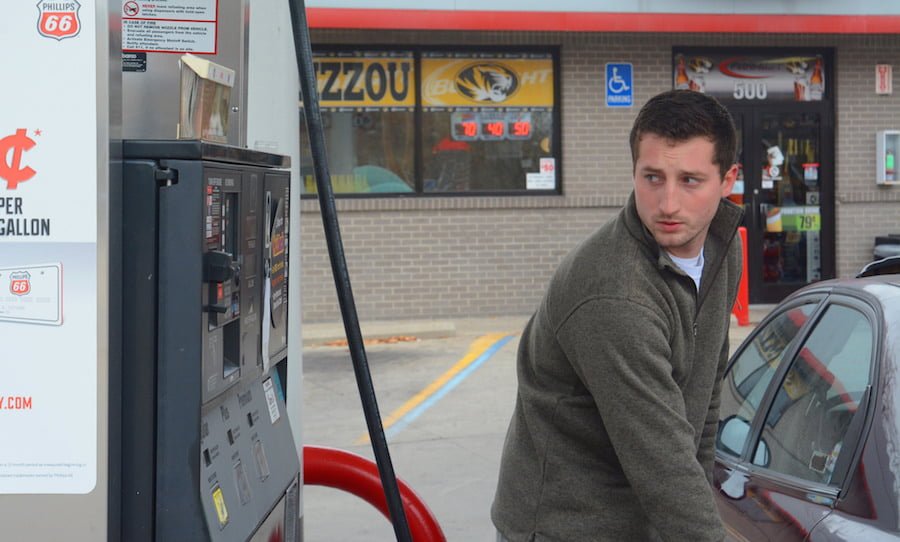 man at gas pump